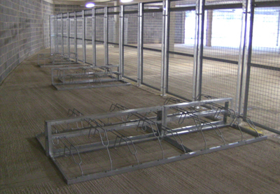 Security Bike Shelter - A secure bicycle shelter, curved back frame clear cladding mesh gates